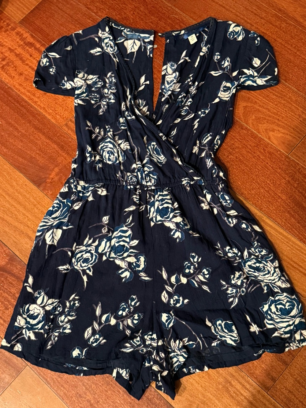 Navy Floral Wrap-Style Romper with White Rose Print